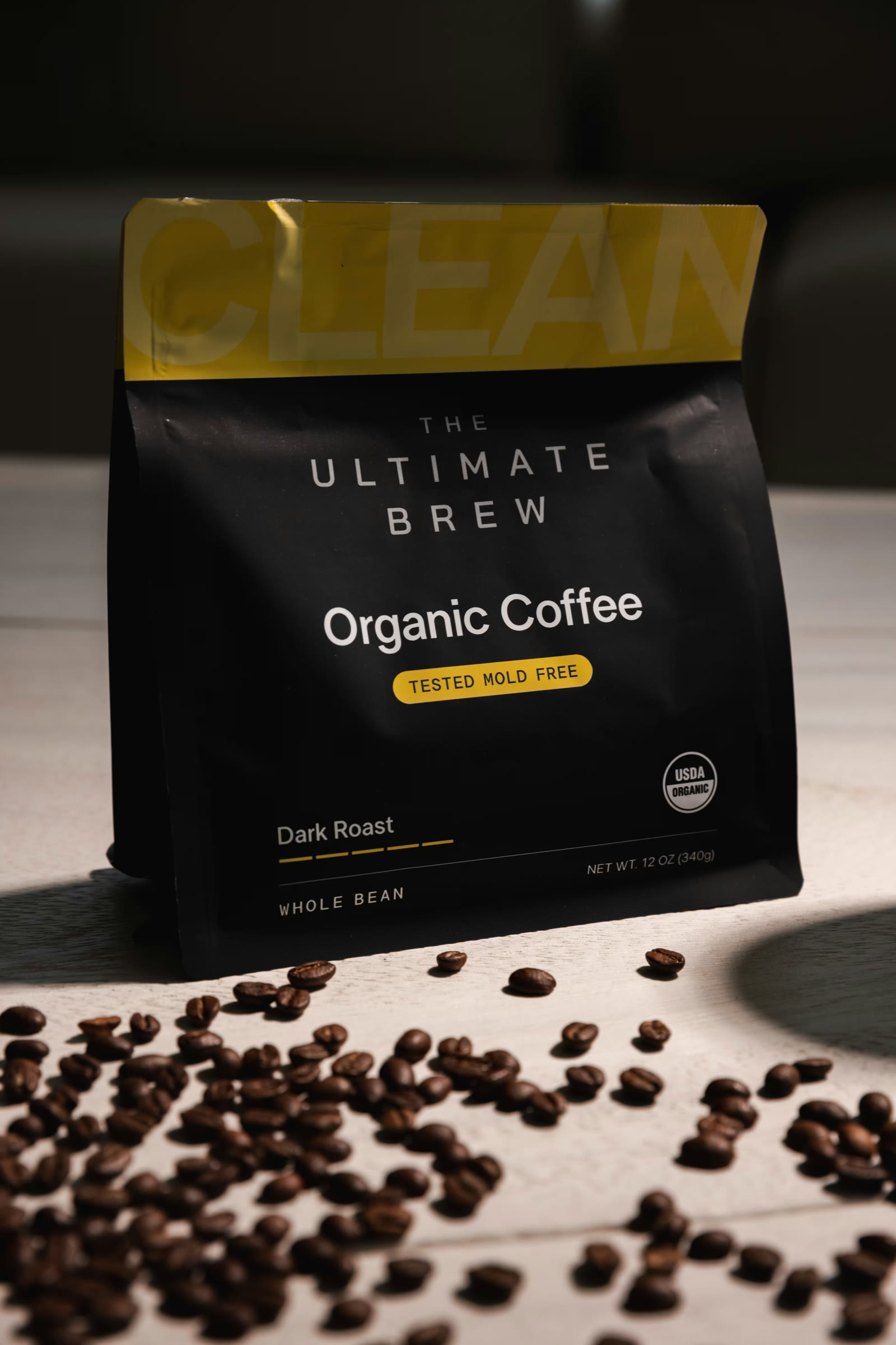 A bag of The Ultimate Brew Dark Roast with whole beans